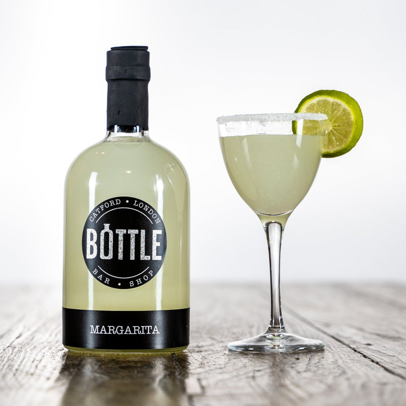 handmade-margarita-cocktail-with-salt-rim and lime garnish, made in the UK, in a martini glass