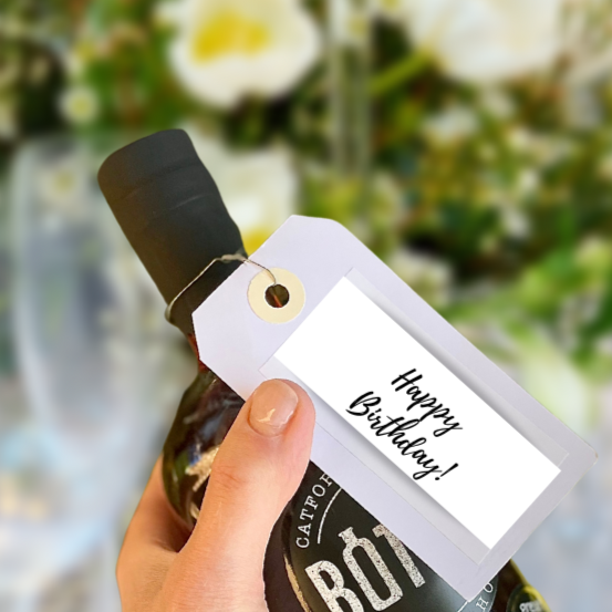 Happy Birthday message on a label, on a bottled cocktail