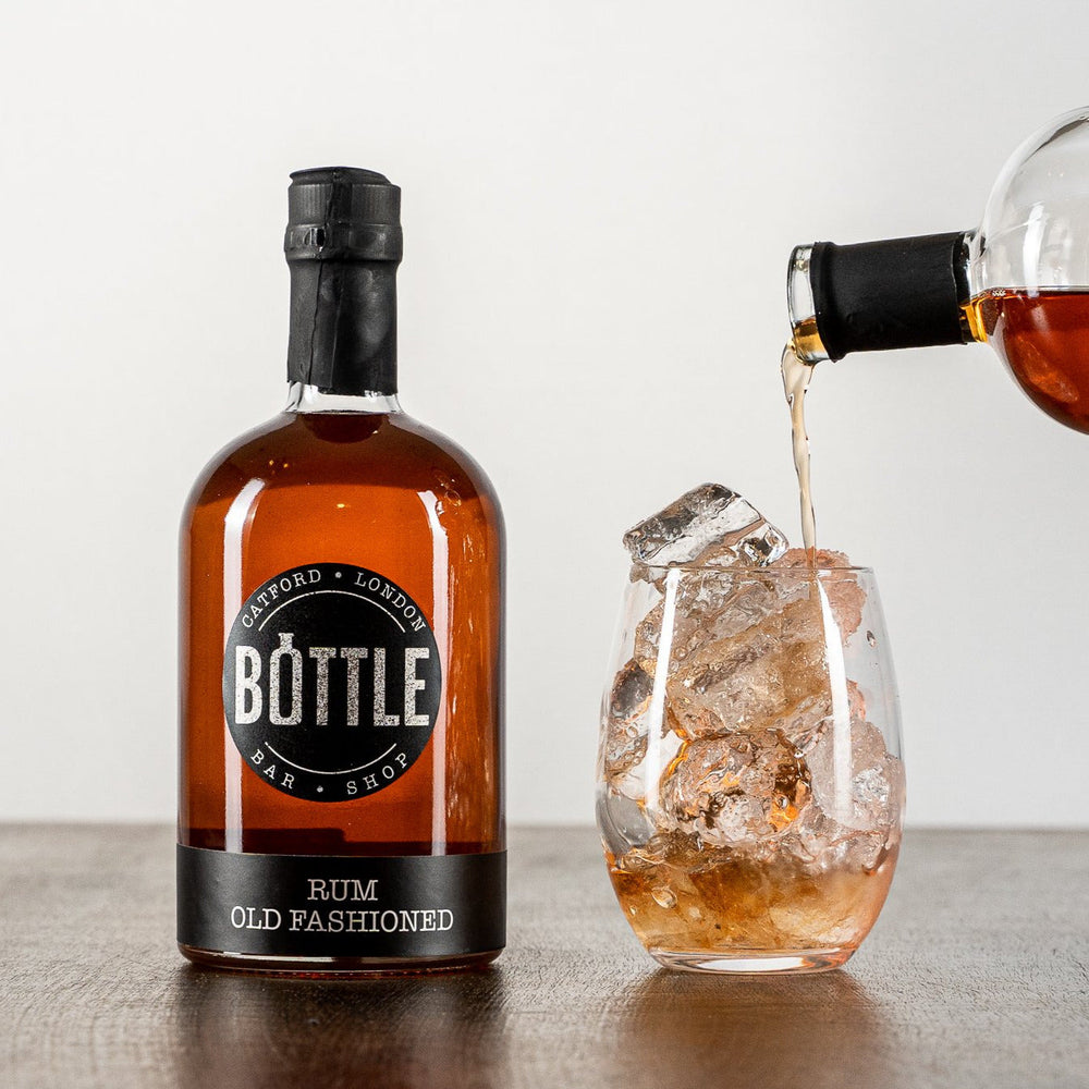 Handmade Rum Old Fashioned, made in small batches, made in the UK, poured into a glass with ice