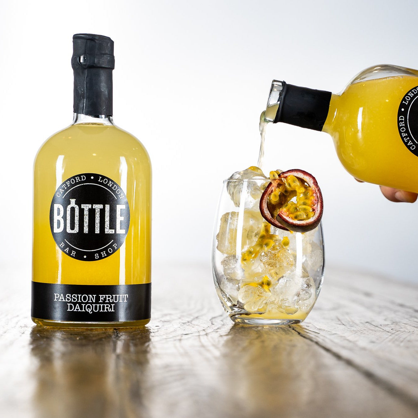 
                  
                    Award winning Passion Fruit Daiquiri poured into a glass, made in the UK, with passion fruit
                  
                