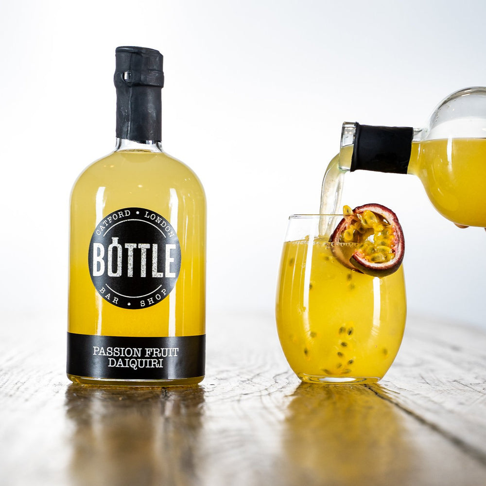 
                  
                    Award winning Passion Fruit Daiquiri in a glass, made in the UK, with passion fruit, poured
                  
                