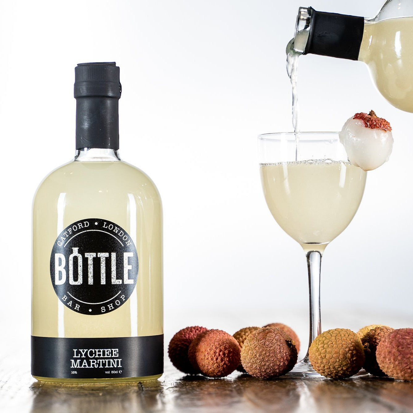 Delicious-lychee-martini-cocktail-with-lychees poured into a martini glass